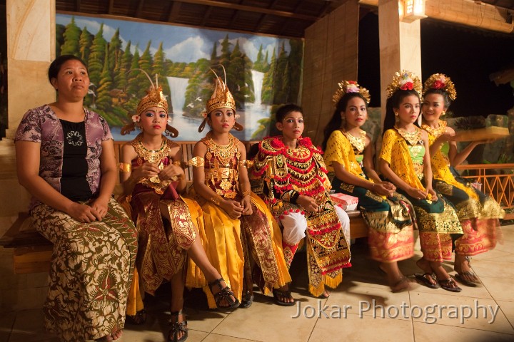 Amed_20100509_101-flattened.jpg - 1. BACKSTAGE, AMED #1 - Young Baris and Legong dancers wait backstage with their chaperone before an Odalan (anniversary) performance, Amed, Karangasem Regency.